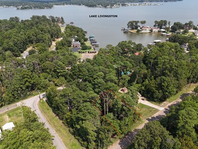 Aerial view of property with lake and boat ramp wi