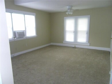 Spacious living room with new carpet, paint, blind