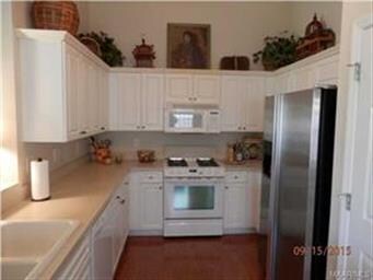 Kitchen with lots of cabinets and pantry.