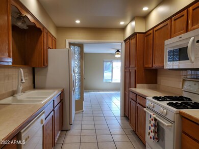 Kitchen offers gas range, built-in microwave and new gooseneck faucet