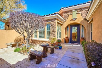 Front Patio - Entering the gate you are greeted with an absolutely beautiful Wrought Iron Door and patio to sit and have coffee at in the mornings
