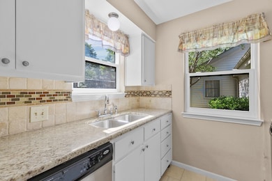 Kitchen featuring a sink, stainless steel dishwas