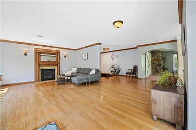 Sconce lighting highlights the antique oak mantel gas fireplace.