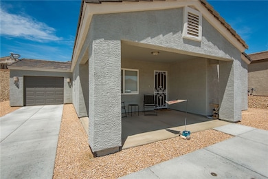 View of front of house with stucco siding, a garag