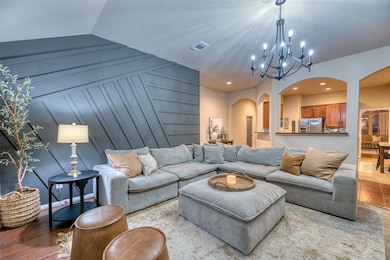 Cozy living space featuring warm lighting and decorative trim wall that adds texture and depth.
