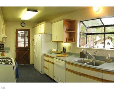 Kitchen. Kitchen appliances include Jenn-air 5 bur