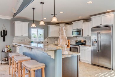 Spacious center island w/ breakfast bar.