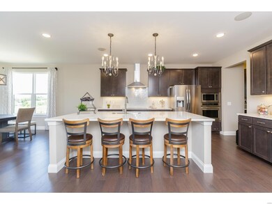 Kitchen with Oversized Center Island with Quartz Countertops and Breakfast Bar