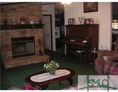 Living Room. living room has piano as well that is
