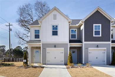 Townhome / multi-family property with driveway, bo