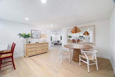 Dining room with light wood-style floors, recessed lighting, and baseboards