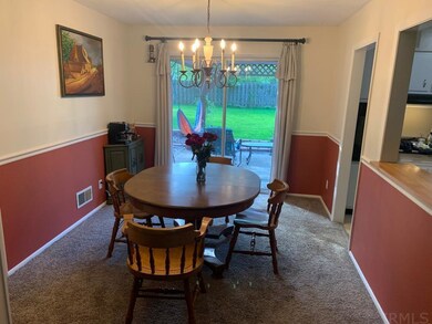 Sliding door leads to patio and back yard