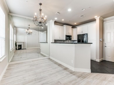 Kitchen featuring open floor plan, light wood-type