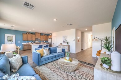 Living room featuring baseboards, visible vents, r