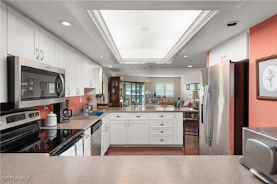 Kitchen with stainless steel appliances, a sink, a