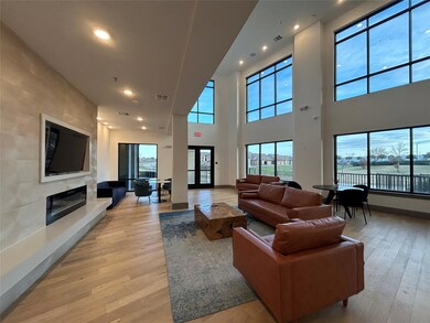 Living room featuring a water view, a fireplace, a