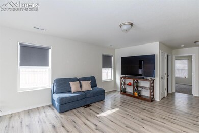 Living room featuring light hardwood / wood-style 