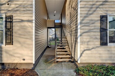 Covered entryway into the condo with just a few steps to the door.