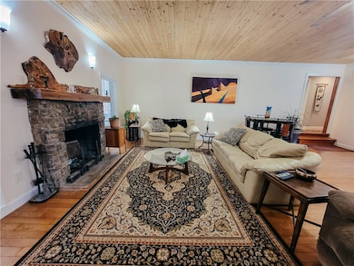 Living room with real wood burning fireplace