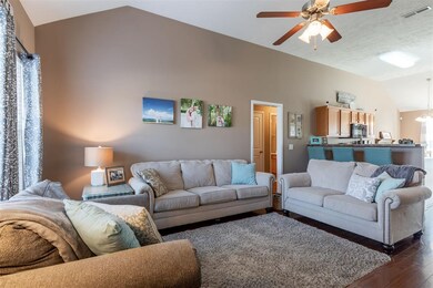 High ceilings and warm designer paint tones make t