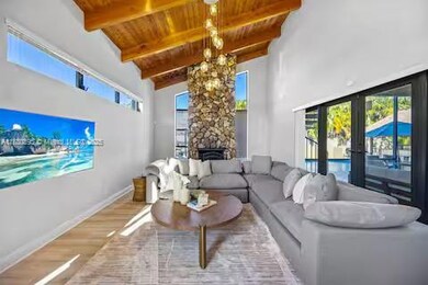 This living room’s so cozy and chic, even the stone fireplace is flexing its glow-up!