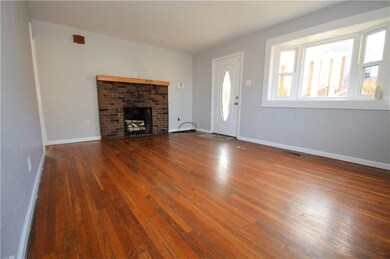 Living room with hardwood and Fire place