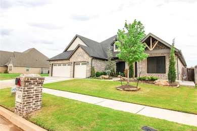 Craftsman house featuring concrete driveway, brick