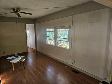 Livingroom towards hall to 2 bedrooms and the bath