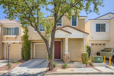 Townhome / multi-family property featuring a garag