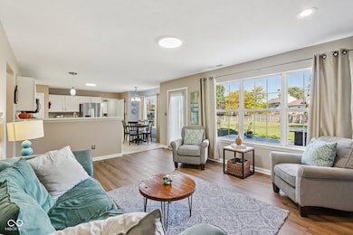 Great room opens to backyard and kitchen with bar area