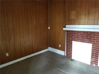 This cozy unit features a double sided wood burnin