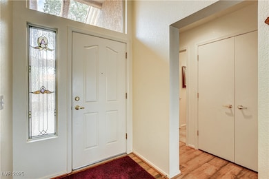 Entrance foyer with light wood-style flooring