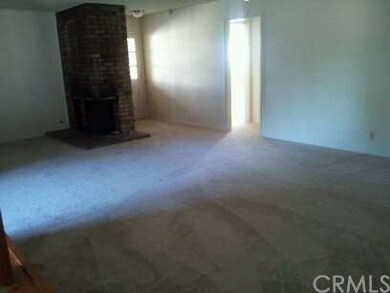 Portion of living room with fireplace viewed from 
