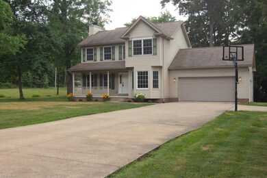 Nice, wide concrete driveway with a turnaround bes