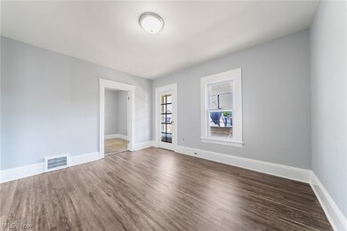 Unfurnished room featuring hardwood / wood-style flooring