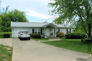 Concrete drive leading to garage
