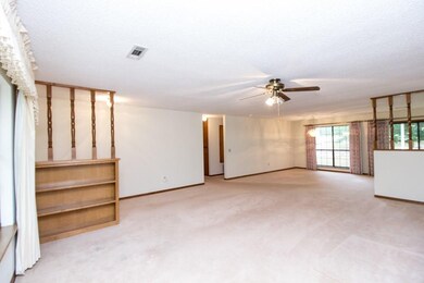 LIVING ROOM WITH BUILT IN SHELVING