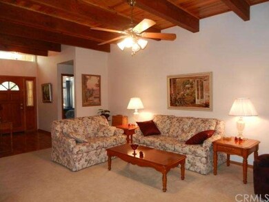 Open Living Room with Blued Pine Wood & Beam Ceili