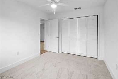 Unfurnished bedroom featuring carpet flooring and a ceiling fan