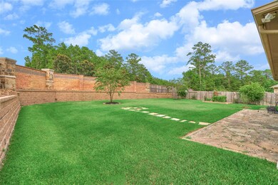 Well manicured lawn is like green carpet, and a *bonus* to have the aesthetics of the custom brick/stone community fence with towering trees for ultimate privacy - no rear neighbors!