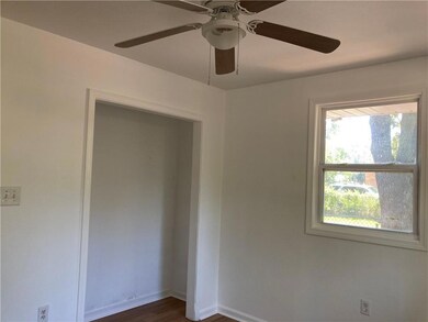 Bedroom has laminate flooring