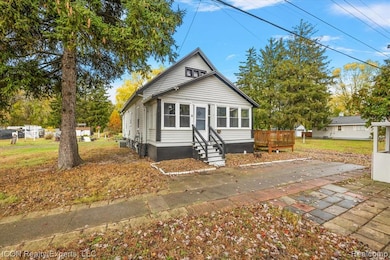 Bungalow-style house with a patio and a front yard