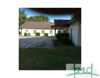 Exterior Front. Paved parking lot serves the sanct