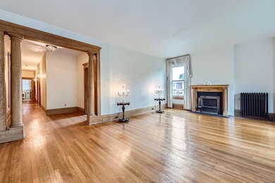 Gorgeous woodwork and columns set the living room apart