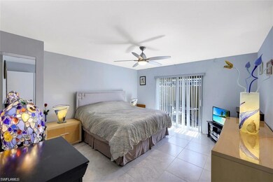 Bedroom with light tile patterned floors, access t