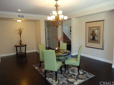 Formal dining room with lovely chandelier and nich
