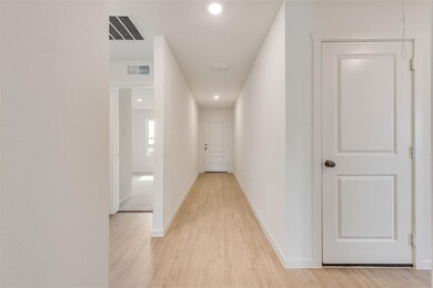 Hallway featuring light wood-type flooring