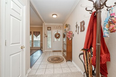 Entryway with formal dining room to the right as you enter the home.