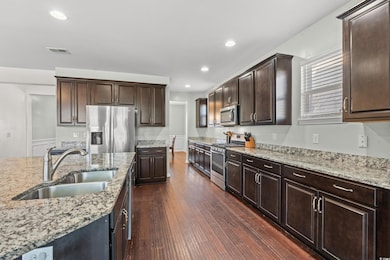 Kitchen with appliances with stainless steel finis