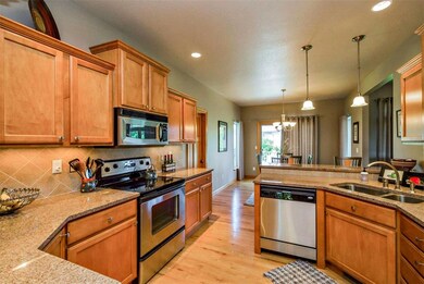 Cherry cabinets, granite countertops, ceramic tile